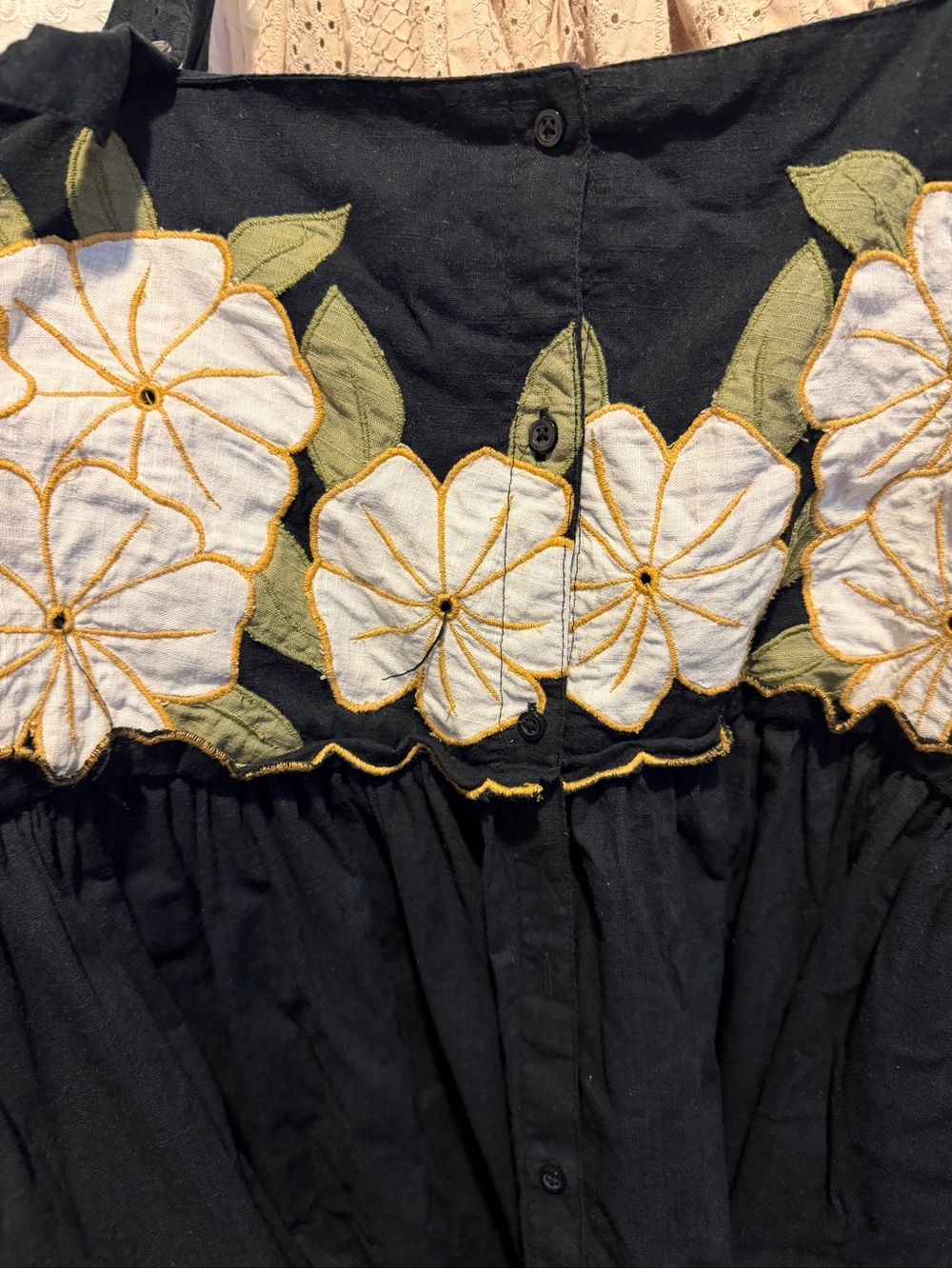 THE GREAT. Black Midi Dress with White Floral Trim and Green Leaves - Picture 4 of 4